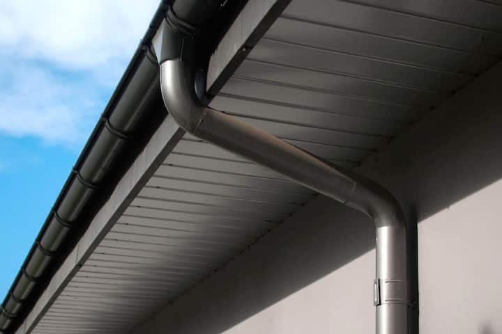 Corrosion-resistant galvanized gutters installed on a commercial building in Spring